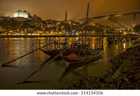 Panorama old Porto river Duoro, vintage port transporting boats, old town, town of Gaia and famous bridge Ponte dom Luis, Portugal