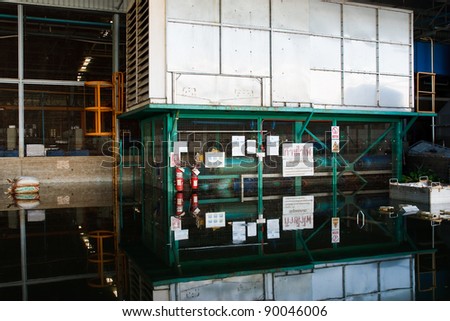 BANGKOK - NOV. 25: Factories damaged at Nava Nakorn Industrial, which is flooded for a period of 1 month on November 25, 2011 at Nava Nakorn Industrial Pathum Thani, in Bangkok.