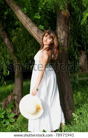 Portrait of romantic woman at fairy forest.