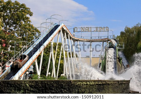 VIENNA, AUSTRIA - AUGUST, 10 : Danube Jump (Donau-Jump), Water game in a hollowed trunk at Wiener Prater, Prater Amusement Park on August 10, 2012