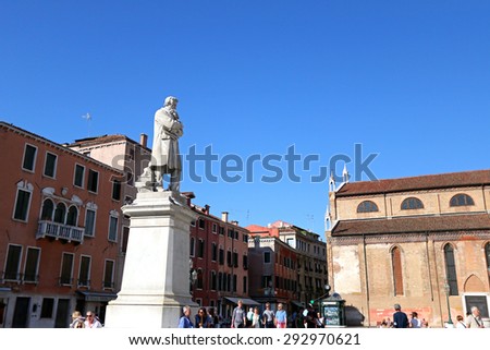VENICE, ITALY - SEPTEMBER 2014 : People hang out at Statue of Nicolo Tommaseo monument in Venice, Italy on September 14, 2014. Nicolo Tommaseo was a linguist, journalist, essayist, Italian irredentism