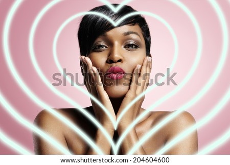 portrait of a black woman sending a kiss with neon hearts