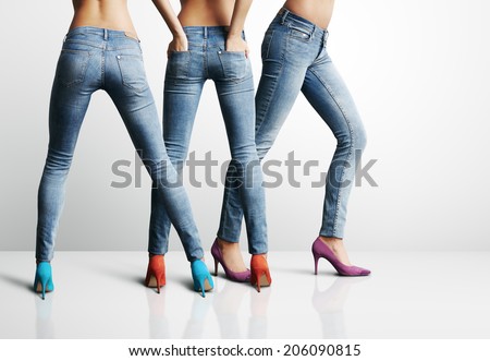 Similar – Image, Stock Photo Three legs in jeans and sneakers, standing on the street in confetti, at carnival.