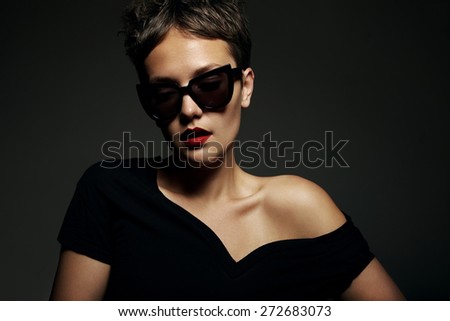 dark portrait of woman wearing sunglasses