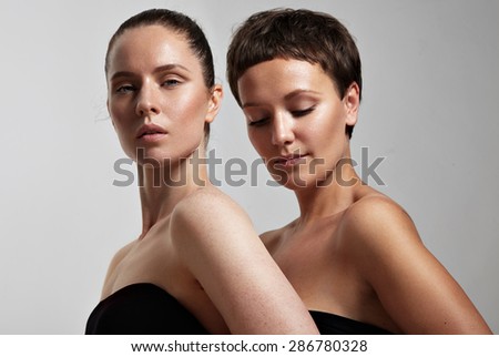 two young woman with a different skin type