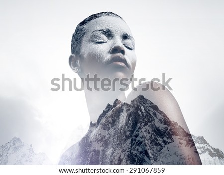 black woman covered by white powder double exposure with a mountain