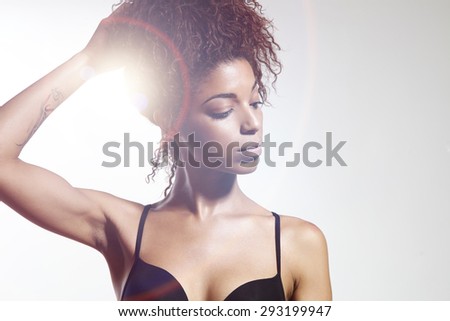 pretty black woman with an afro hair. Sun flair