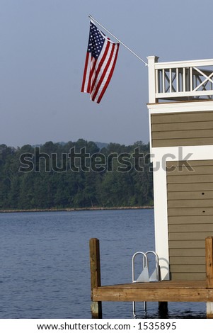 Flag hanging from lake house on July 4th.