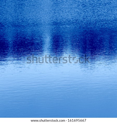 smooth water surface with reflection