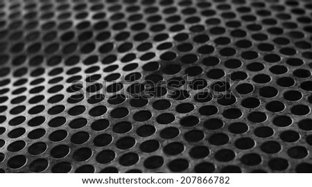 bent perforated metal background