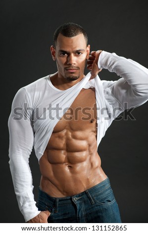 Male fitness model show ripped six pack abs