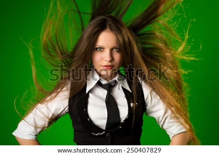 Girl with fluttering hair. Close-up portrait