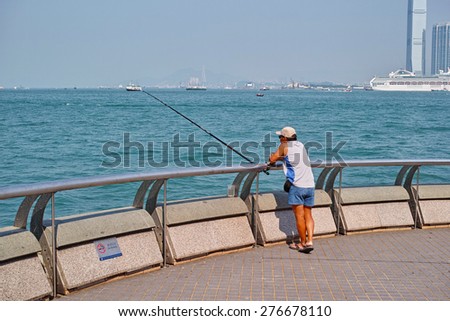 HONG KONG-SEPTEMBER, 2012: Fisherman on the waterfront of Hong Kong. Hong Kong Special Administrative Region of the People\'s Republic of China