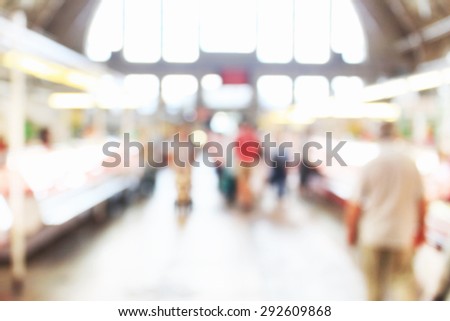 People at crowded place at market, unfocused effect