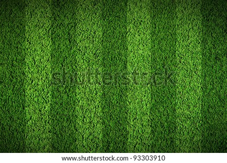 Football lined green grass