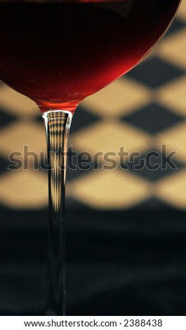 red wine in glass on checkered background