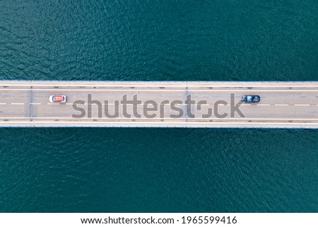 Similar – Image, Stock Photo Bridge over sea on cloudy day