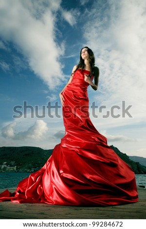 beautiful young woman in red long dress