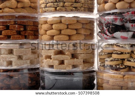 stack of various kinds of pastries in a transparent jar packaging