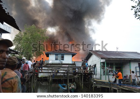 TARAKAN, INDONESIA - MAY 29: Fires in densely populated urban waterfront on May 29, 2013 at Tarakan, Indonesia