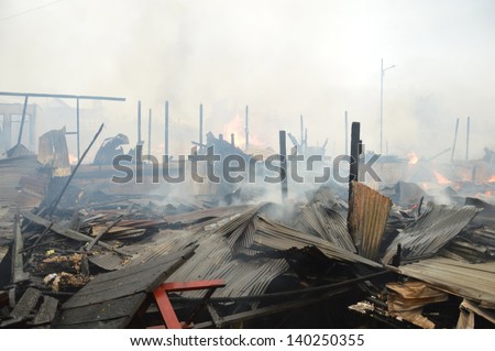 TARAKAN, INDONESIA - MAY 29: Fires in densely populated urban waterfront on May 29, 2013 at Tarakan, Indonesia