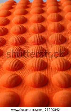 detailed pattern of orange and brown seat cushion