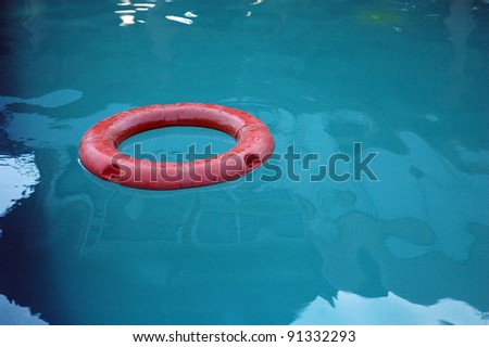 an orange buoy in the middle of the pool
