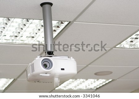 Overhead projector under the ceiling in boardroom at office