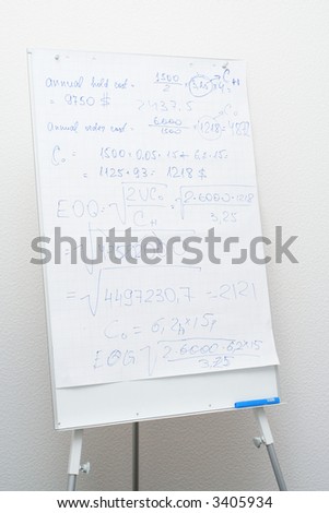 Flip chart in the office with text of calculations
