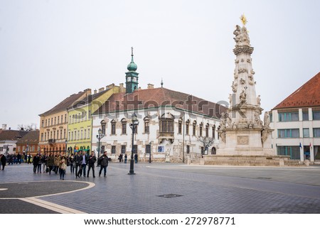 BUDAPEST, HUNGARY - MARCH 12, 2015: Tourists walk on the Trinity Square in Budapest. March 12, 2015. Budapest, Hungary