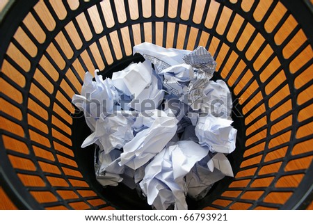 Wasted paper in litter bin, rubbish