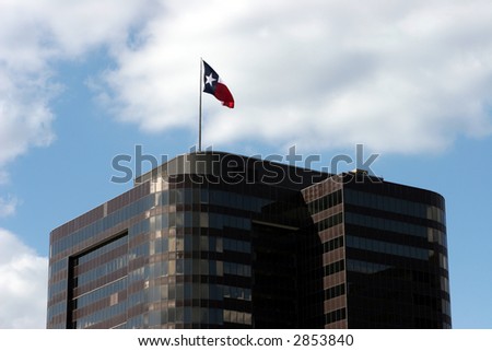 Black office building with Texas flag