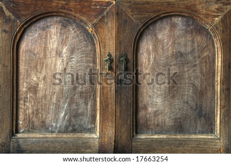 Doors on an old wooden cupboard with grain texture