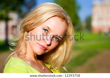 Portrait of the beautiful girl in beams of the coming sun