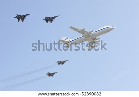 MOSCOW, RUSSIA - MAY 09: flying command post IL-80 accompanied by MIG-29 fighters during Victory parade. May 09, 2010 in Moscow, Russia.
