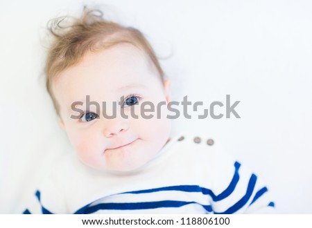 Funny baby in a striped navy shirt