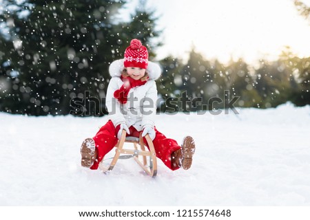 Similar – Image, Stock Photo Little girl sledding at Sierra Nevada ski resort.