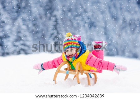 Similar – Image, Stock Photo Little girl sledding at Sierra Nevada ski resort.