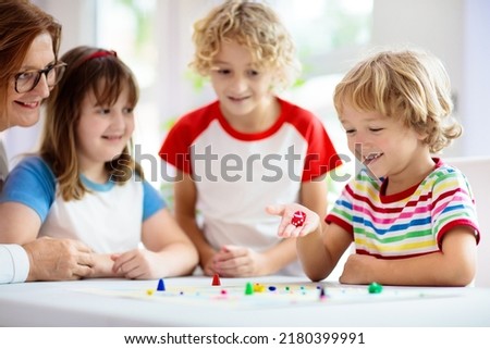 Similar – Image, Stock Photo Little kid playing with cards of words and pictures.