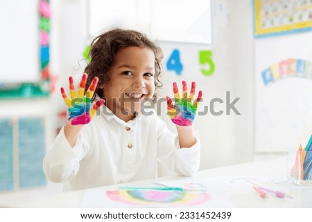 Similar – Image, Stock Photo Little girl painting at home on the table