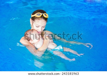 Image, Stock Photo Mother and son diving on a swimming pool