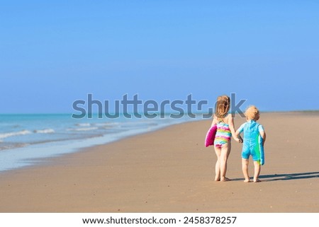 Image, Stock Photo Boy running on sand dunes