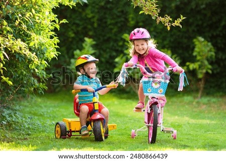 Similar – Image, Stock Photo Two children playing with their mobile on the beach