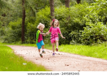 Image, Stock Photo Child playing with acorns