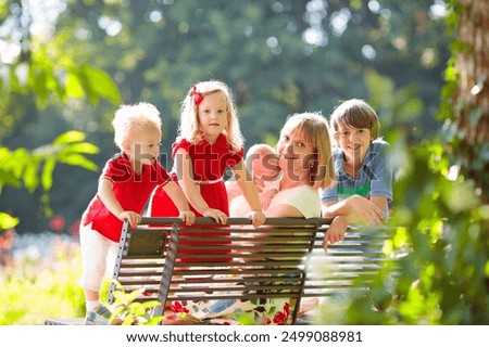 Similar – Image, Stock Photo Four children on a meadow at sunset