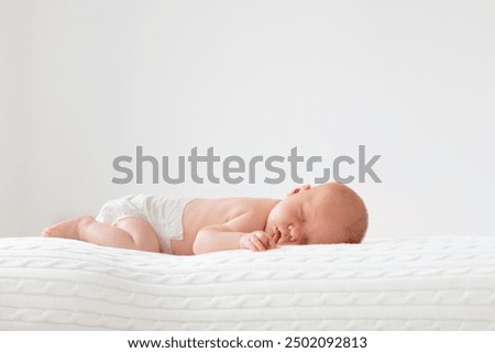 Similar – Foto Bild Baby schläft in Baby Holzbett für Neugeborene. Ein geräumiges, helles Zimmer mit einer Dattelpalme im Hintergrund. Raum kopieren