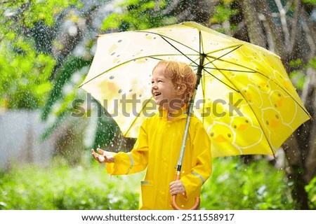 Similar – Image, Stock Photo Cute child under umbrella on rainy day in autumn park