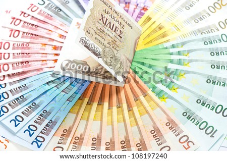 old greek drachma and euro cash notes. euro crisis concept. selective focus
