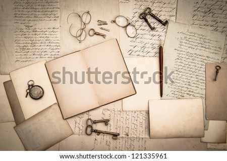 open book, antique accessories, old letters and cards. vintage nostalgic background