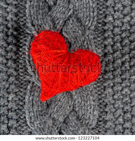 red heart of knitted wool background